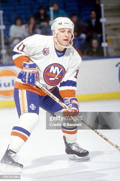 Darius Kasparaitis of the New York Islanders skates on the ice during an NHL game circa 1993 at the Nassau Coliseum in Uniondale, New York.