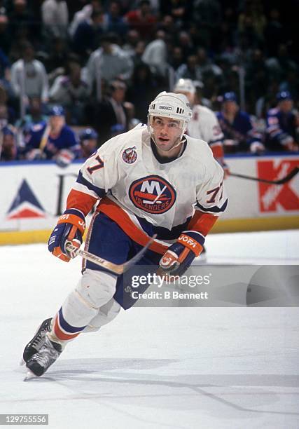Pierre Turgeon of the New York Islanders skates on the ice during an NHL game circa 1993 at the Nassau Coliseum in Uniondale, New York.
