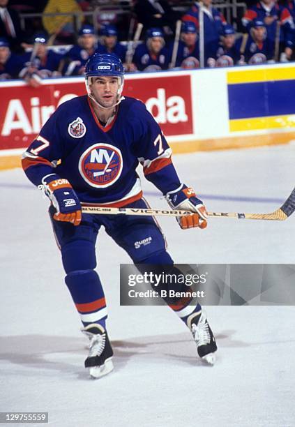 Pierre Turgeon of the New York Islanders skates on the ice during an NHL game circa 1993.