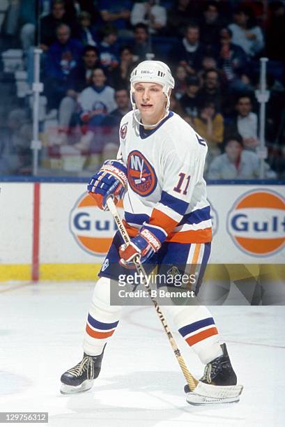 Darius Kasparaitis of the New York Islanders skates on the ice during an NHL game in November, 1992 at the Nassau Coliseum in Uniondale, New York.