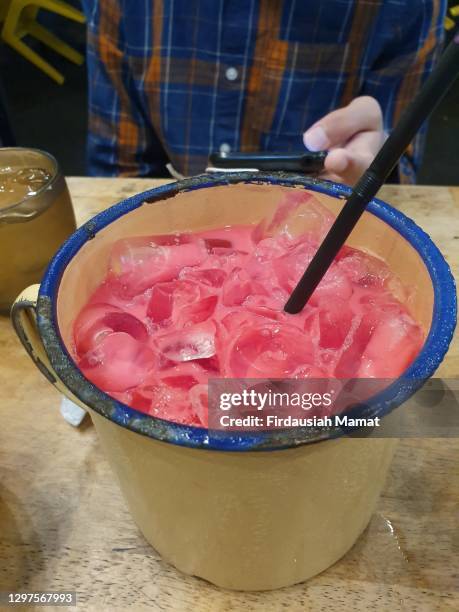malaysian famous drink air bandung or known as iced rosewater milk drink - rose colored stock pictures, royalty-free photos & images