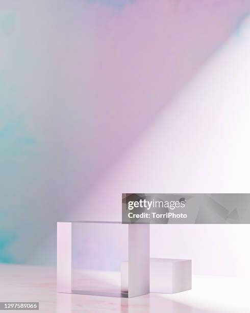 two glass cube prisms on pink background - 3d cube stock-fotos und bilder