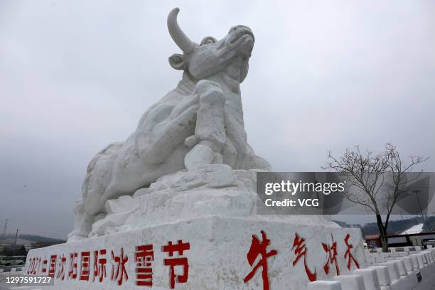 Bull-shaped snow sculpture is on display during the 2021 Shenyang International Ice and Snow Festival on January 21, 2021 in Shenyang, Liaoning...