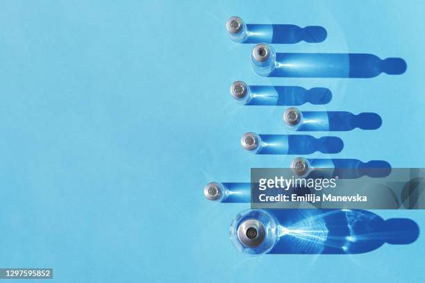 medical glass vials of vaccine - laboratory equipment stock-fotos und bilder