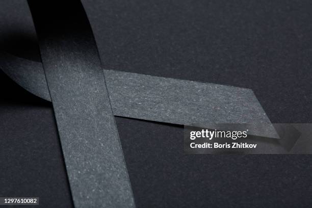 black awareness ribbon. - melanoma awareness stock pictures, royalty-free photos & images