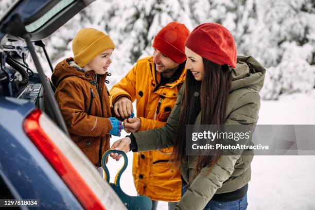 family going to have some fun with sleds on snow - family winter sport stock pictures, royalty-free photos & images