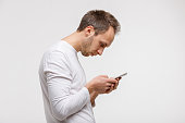 man looking and using smart phone with scoliosis, Incorrect posture