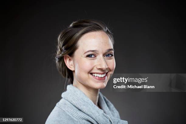portrait of woman smiling to camera - michael virtue stock pictures, royalty-free photos & images