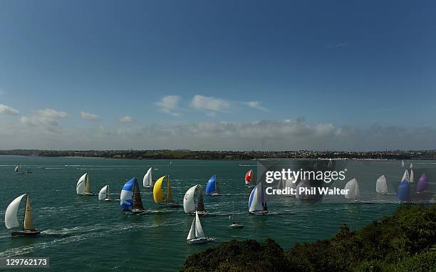 The flotilla of yachts head out to sea at the start of the Coastal Classic Yacht Race in Auckland Harbour on October 21, 2011 in Auckland, New...