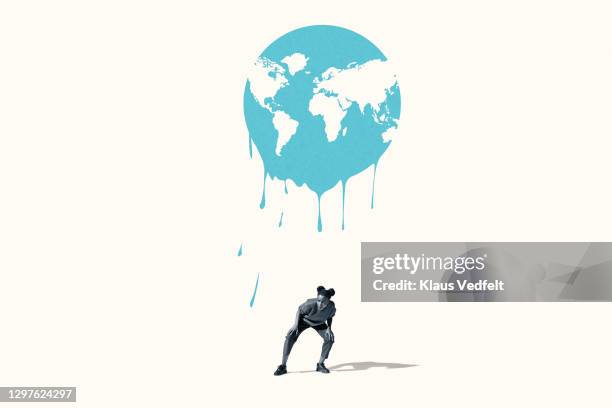 woman avoiding toxic melting of blue planet earth - avoidance concept stock pictures, royalty-free photos & images