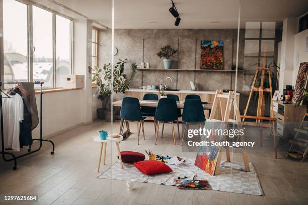 modern painting by the ladder in empty apartment - art studio stock pictures, royalty-free photos & images