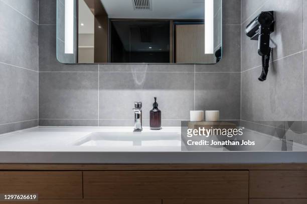 comfortable and tidy toilet toiletries - domestic bathroom stock pictures, royalty-free photos & images