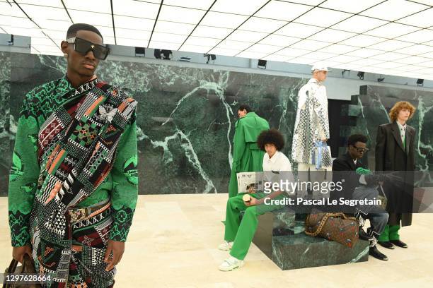 In this image released on January 21st, models walk the runway during the Louis Vuitton Menswear Fall/Winter 2021-2022 show as part of Paris Fashion...