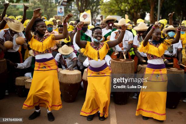 Supporters of President Yoweri Museveni celebrate prior to him speaking to them on January 21, 2021 in Kampala, Uganda. The electoral commission in...