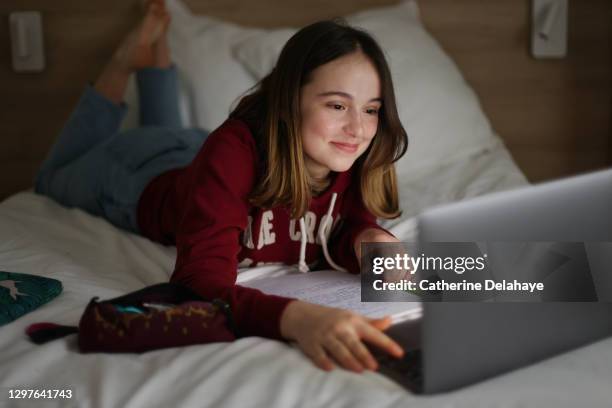a 15 years old girl attending online school classes from home - 14 15 years girl stock pictures, royalty-free photos & images
