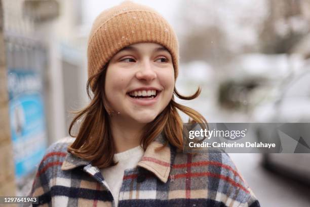 portrait of a 15 years old girl in a snowy street - 14 15 years girl stock pictures, royalty-free photos & images