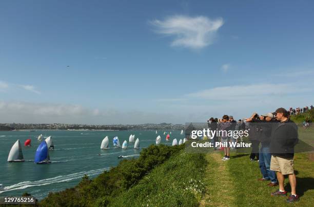 The flotilla of yachts head out to sea at the start of the Coastal Classic Yacht Race in Auckland Harbour on October 21, 2011 in Auckland, New...