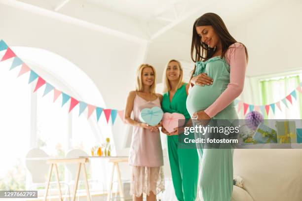 anticipating results during a gender reveal party - gender reveal stock pictures, royalty-free photos & images