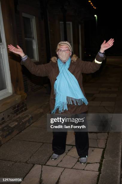 Woman takes part in the Clap for Heroes event in Saltburn on January 21, 2021 in Saltburn-by-the-Sea, England. During the first Coronavirus pandemic...