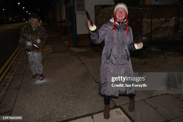 Two women take part in the Clap for Heroes event in Saltburn on January 21, 2021 in Saltburn-by-the-Sea, England. During the first Coronavirus...