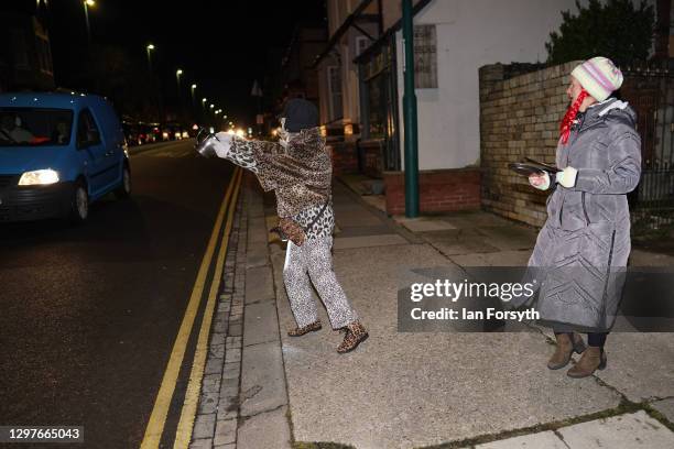 Two women take part in the Clap for Heroes event in Saltburn on January 21, 2021 in Saltburn-by-the-Sea, England. During the first Coronavirus...