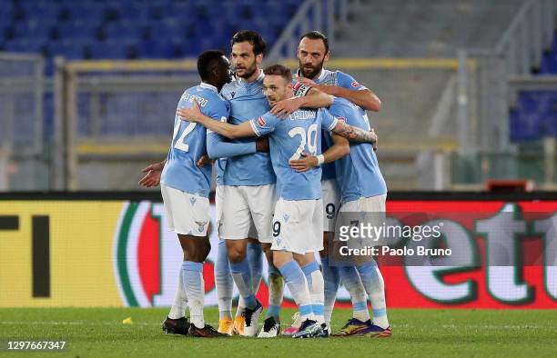 Marco Parolo of SS Lazio celebrates with team mates Jean-Daniel Akpa Akpro, Manuel Lazzari and Vedat Muriqi after scoring their side's first goal...