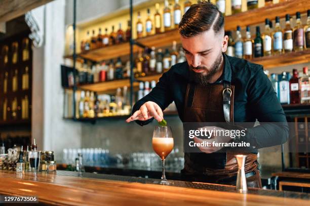 bartender preparing cocktails - latin america business stock pictures, royalty-free photos & images