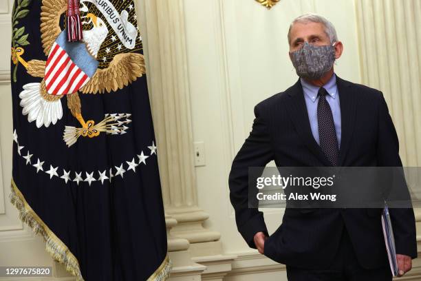 Dr Anthony Fauci, Director of the National Institute of Allergy and Infectious Diseases, listens during an event at the State Dining Room of the...