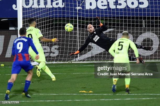 Luis Suarez of Atletico de Madrid scores their side's second goal from the penalty spot past Marko Dmitrovic of SD Eibar during the La Liga Santander...