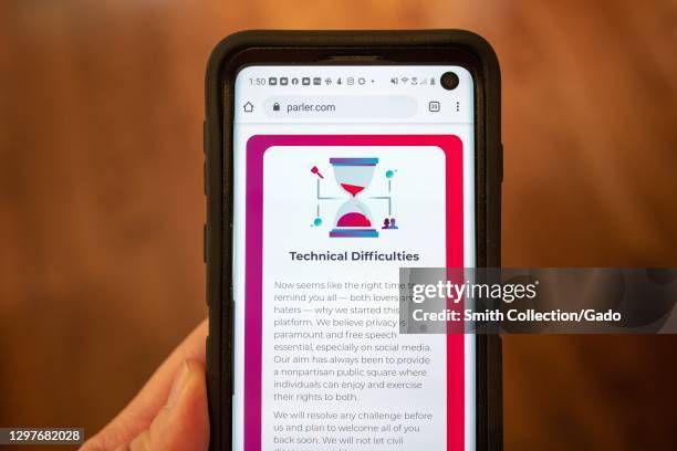 Mobile device showing Parler website with statement regarding "Technical Difficulties", following the app's removal from its former Amazon hosting...