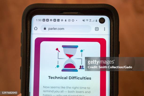 Mobile device showing Parler website with statement regarding "Technical Difficulties", following the app's removal from its former Amazon hosting...