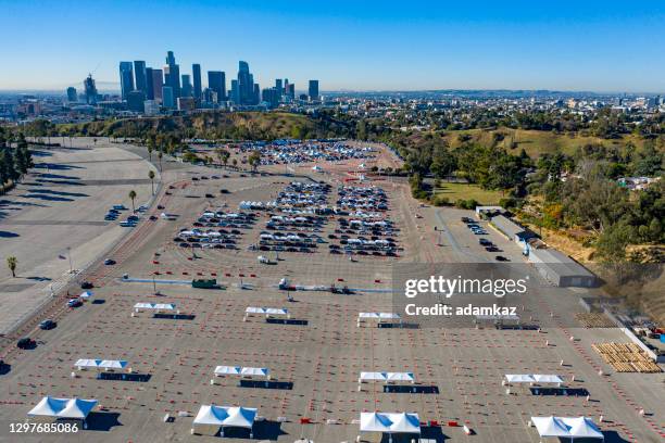 aerial of covid-19 vaccine distribution in parking lot - global health stock pictures, royalty-free photos & images