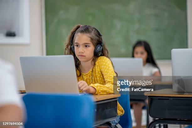 e-learning in the classroom - e girls stock pictures, royalty-free photos & images