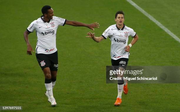 Mateus Vital of Corinthians celebrates with teammate Jo after scoring a second goal of his team during a match between Corinthians and Sport Recife...