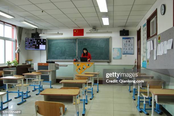 Teacher takes an online class at a middle school in Mentougou district on January 21, 2021 in Beijing, China.