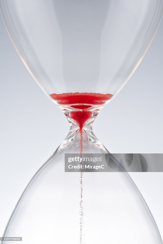 Red Sand Hourglass Running Out of Time