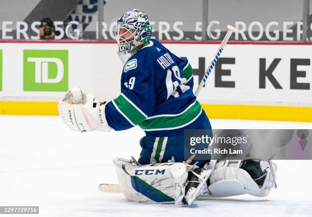 Goalie Braden Holtby of the Vancouver Canucks readies to make a save during NHL hockey action against the Montreal Canadiens at Rogers Arena on...