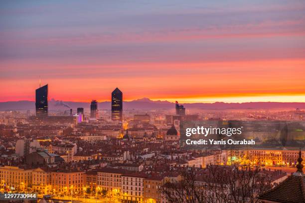 winter sunrise over the city of lyon, france, with mont-blanc and the alps in the backrgound - lyon photos et images de collection