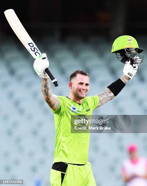 Alex Hales of the Thunder celebrates bringing up his century during the Big Bash League match between the Sydney Sixers and the Sydney Thunder at...