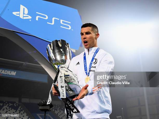 Cristiano Ronaldo of Juventus celebrates with the PS5 Supercup after victory in the Italian PS5 Supercup match between Juventus and SSC Napoli at...