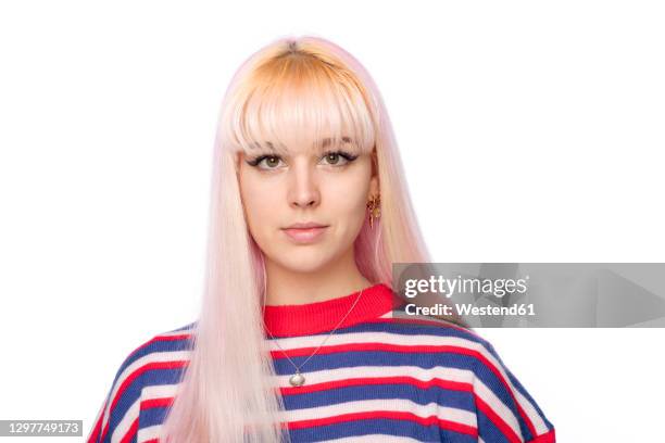 beautiful young woman with blond bangs against white background - striped shirt stock pictures, royalty-free photos & images