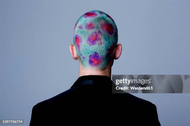 young man with dyed shot hair studio - individuality foto e immagini stock