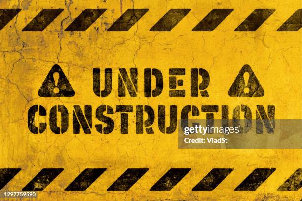 under construction warning sign repair grunge street art mural background - construction sign vector stock illustrations
