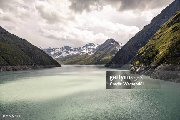 lake in mountain landscape - grande dixence dam stock pictures, royalty-free photos & images