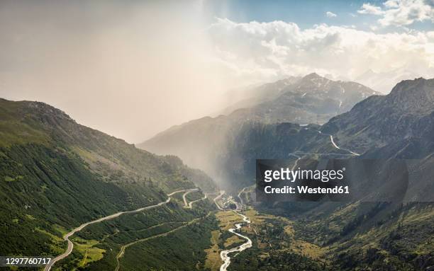 storm clouds over mountain and valley with river - rhone river stock pictures, royalty-free photos & images
