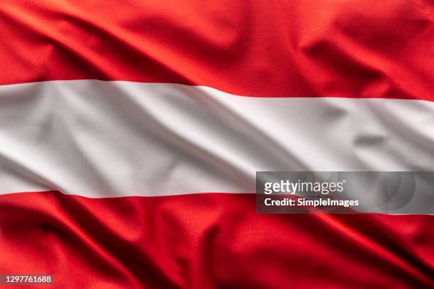 flag of austria blowing in the wind. - austria flag stock pictures, royalty-free photos & images