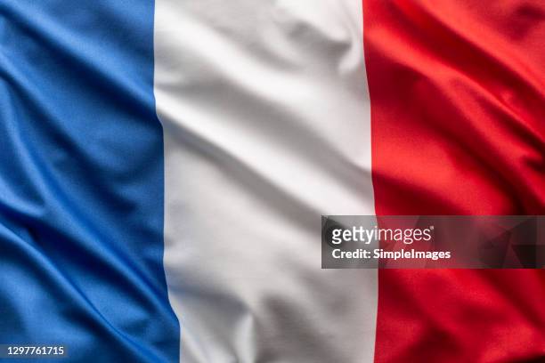 flag of france blowing in the wind. - frankreich stock-fotos und bilder