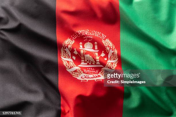flag of afghanistan blowing in the wind. - アフガニスタン ストックフォトと画像