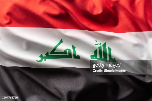 flag of iraq blowing in the wind. - iraqi flag stock pictures, royalty-free photos & images