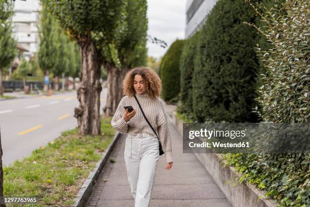 Photo Walk Using Phone Female Walking With Phone Photos and Premium High Res Pictures - Getty ...